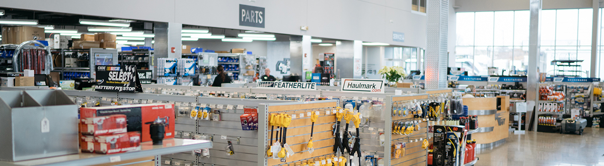 The interior of Golden Gait Trailer & RV's parts department with aisles of various trailer and RV components